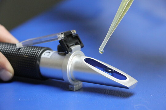 drop of urine about to fall into a Clinical Pet Urine Refractometer