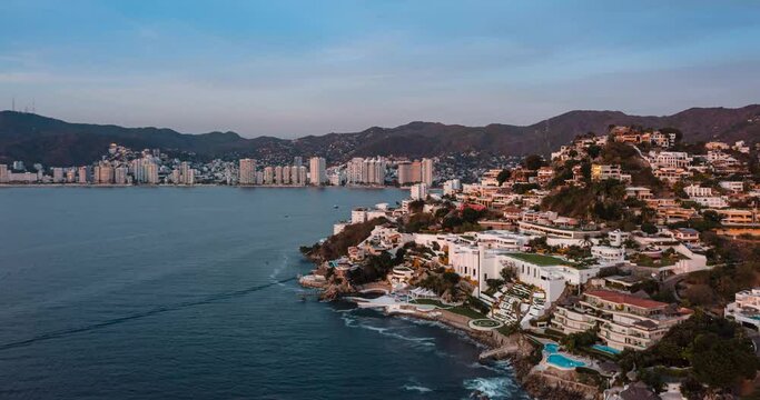 Aerial hyperlapse over Acapulco Bay towards Las Brisas during sunset