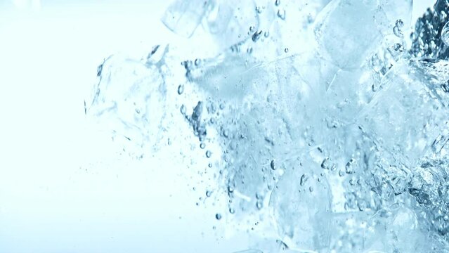 Super slow motion of rotating ice cubes in water. Filmed on high speed cinema camera, 1000 fps. Underwater composition.