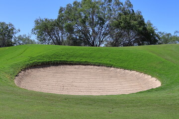 A golf bunker filled with sand