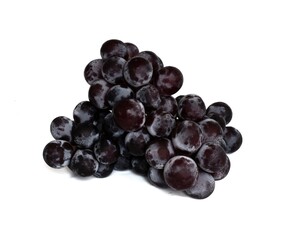 Close-up of sweet black grapes isolated on white background.