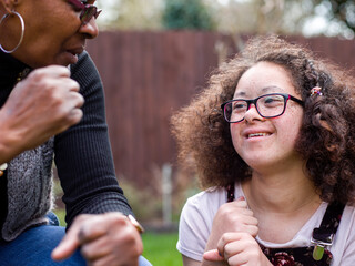 Mother and daughter in backyard