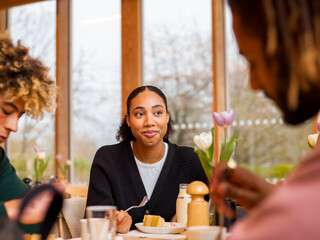 Group of young friends sitting in cafe