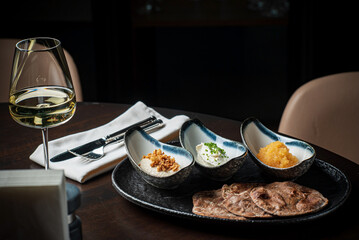 pita with different dips and white wine