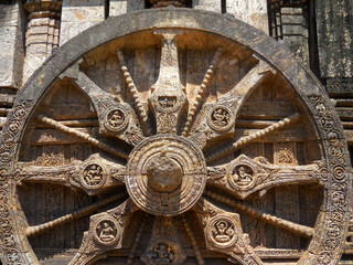 The famous stone chariot wheel engraved in the walls of historic Sun temple in Konark (Odisha, India), a world heritage site.