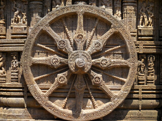 The famous stone chariot wheel engraved in the walls of historic Sun temple in Konark (Odisha,...