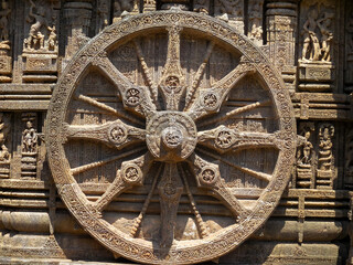 The famous stone chariot wheel engraved in the walls of historic Sun temple in Konark (Odisha, India), a world heritage site.