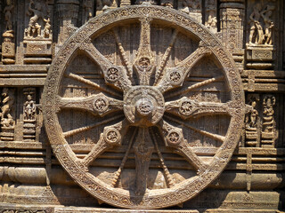 The famous stone chariot wheel engraved in the walls of historic Sun temple in Konark (Odisha, India), a world heritage site.