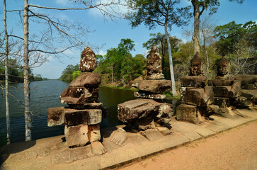 Sculptures gods, spirits, demons on a bridge in South gate of Angkor Thom. Cambodia. Angkor Wat temple complex