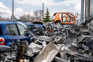 dismantling of a car into spare parts at a junkyard