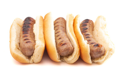 Grilled Bratwurst in a Hotdog Bun on a White Background - obrazy, fototapety, plakaty
