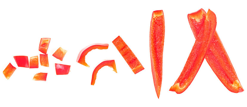 Different shapes and sizes of red sweet bell pepper slices isolated on a white background, top view.