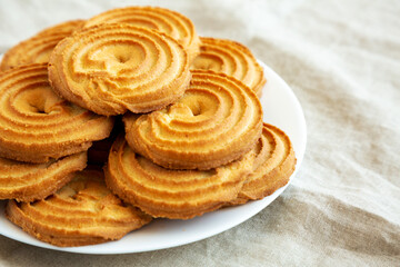Homemade Sprits Biscuits on a Plate, side view. Space for text.