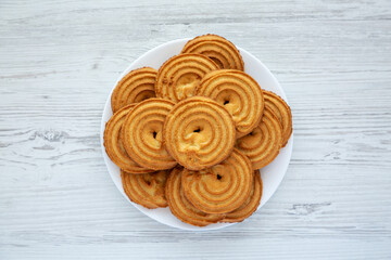 Homemade Sprits Biscuits on a Plate, top view. Flat lay, overhead, from above.