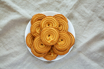 Homemade Sprits Biscuits on a Plate, top view. Flat lay, overhead, from above.