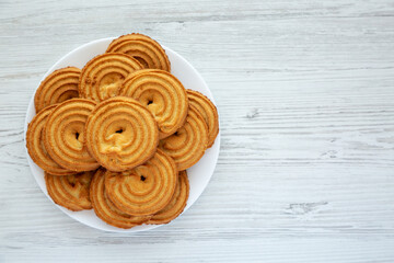 Homemade Sprits Biscuits on a Plate, top view. Flat lay, overhead, from above. Space for text.