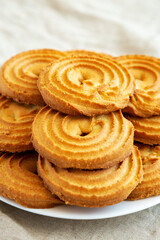 Homemade Sprits Biscuits on a Plate, side view. Close-up.