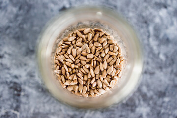 spice jar with sunflower seeds close-up shot of pantry ingredients