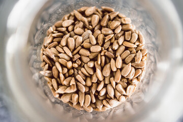 spice jar with sunflower seeds close-up shot of pantry ingredients