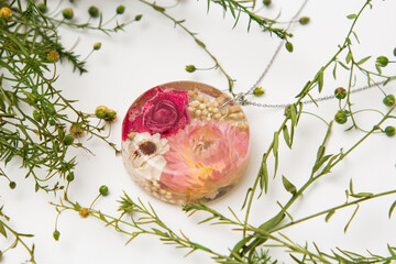 Real flowers in epoxy resin, jewelry