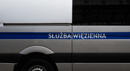 Letters on a Police car in Polish language, Służba Więzienna means Prison Service.