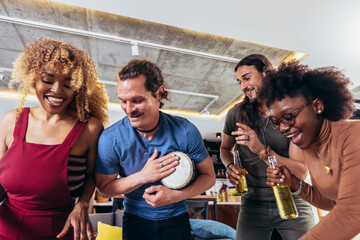 Friends dance fun at a student's party in the apartment