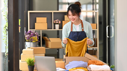 Shot of startup business asian woman preparing products for deliver to customers.