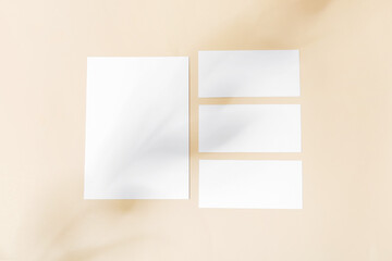 Many blank paper sheets on color background