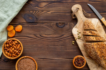 Loaf with dried fruits and nuts. Healthy homemade bread top view
