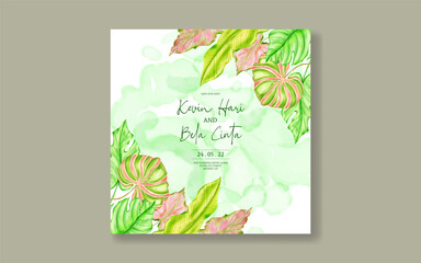 Beautiful wedding invitation with tropical leaves background