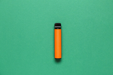 Disposable electronic cigarette on green background