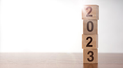 2023 New year's concept. 2023 years written on wooden cubes with copy space. 