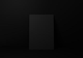 Empty black vertical rectangle A4 paper sheet mockup on floor over black wall, 3D rendering