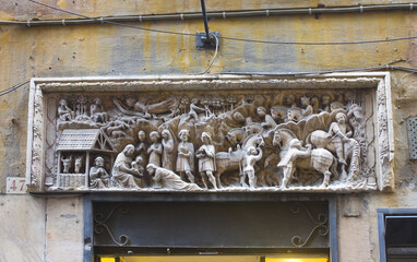  Beautiful architectural detail of the entrance door of an ancient building in the Old Town in Genoa, Italy