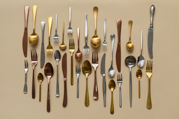 Many different cutlery on color background, top view