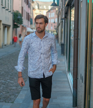 Handsome Italian Dark-haired Boy Walks Downtown In Bermuda