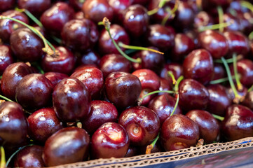 Fresh ripe sweet cherry berries on market