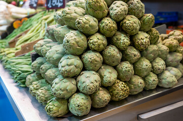 Fresh green artichokes vegetables on farmers market in Spain
