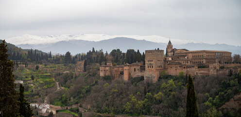 View on medieval fortress Alhambra and snow on Sierra Nevada mountains, Granada, Andalusia, Spain