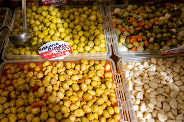 Assortment of pickled green olives on farmers market in Malaga, Andalusia, Spain
