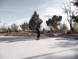 Man performing stylish skate moves in the park