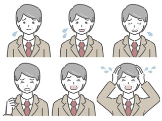 泣く表情の強弱　スーツの中年男性