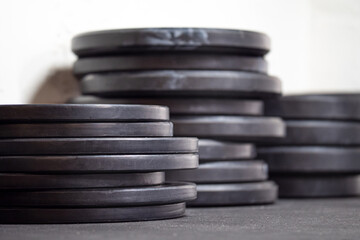 Fototapeta na wymiar Image of black gym weigth plates on the floor