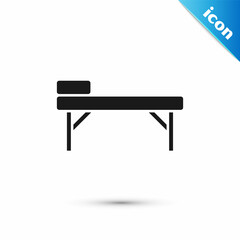 Grey Massage table icon isolated on white background. Vector