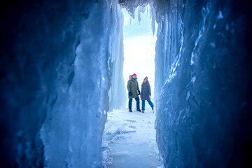 Adventure extreme group people tourist background of frozen grotto and pure ice winter Lake Baikal © Parilov