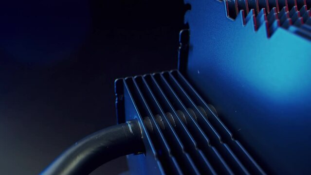 Radiator for cooling the processor of the motherboard of a modern computer in macro photography on a dark background. High quality 4k footage