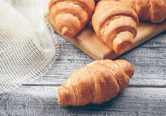 Freshly baked golden brown French croissants. Tasty baked croissants, warm buttery croissants, breakfast concept