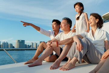Happy family aboard a yacht out to sea
