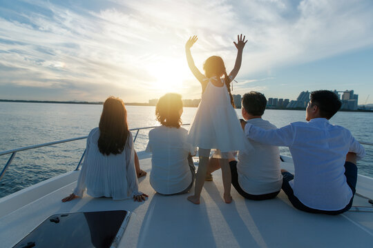 Happy family aboard a yacht out to sea
