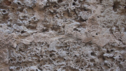 Fragment of the old facade of a house made of natural stone, Cuba, Havana